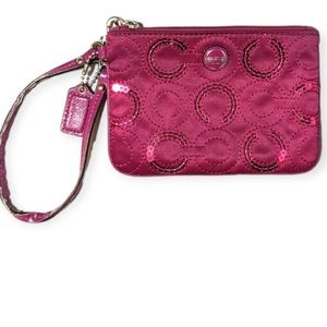 Coach wristlet “C” Op Art Sateen Sequin passion berry purple. F50432